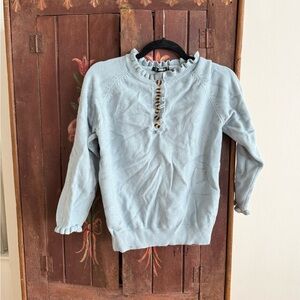 Light Blue Ruffle Sweater with Button Detail